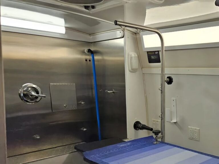 Bridge connecting the grooming table and stainless-steel tub inside the Green Dog Mobile Grooming van